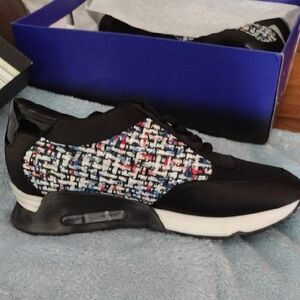 Black and Red Sneakers with Visible Air Cushioning